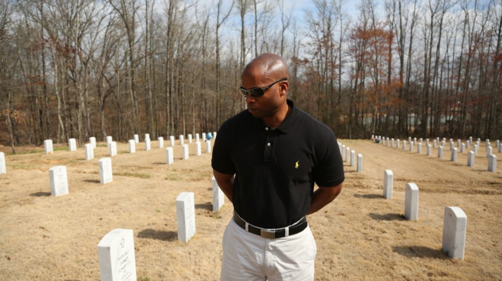 An investigation of the shooting death of 67-year-old Eugene Ellison at the hands of a Little Rock police officer left his sons, including Little Rock police Lt. Troy Ellison, embittered, and with little resolved in the minds of the public. Troy Ellison was photographed at his father’s grave March 7. (Whitney Shefte/The Washington Post)